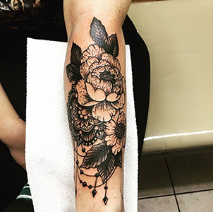 flower design arm tattoo virginia